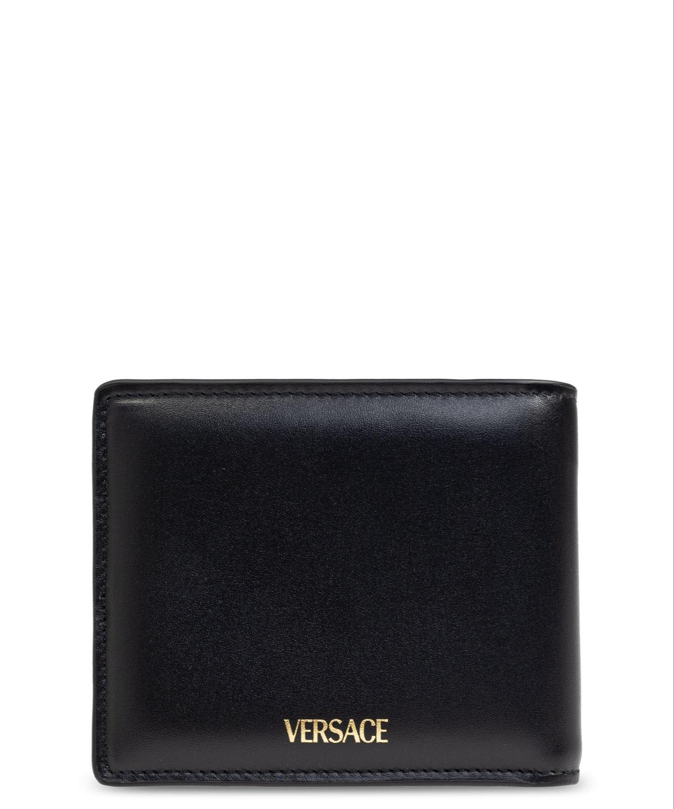 Shop Versace Medusa-plaque Bi-fold Wallet In Black